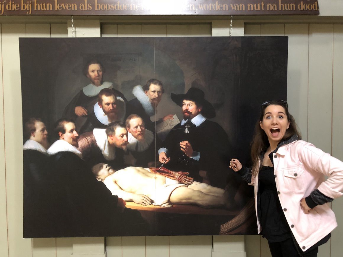Laura pulling a funny face by a copy of the Rembrandt painting “The Anatomy Lesson of Dr. Nicolaes Tulp” which was set in this very room.