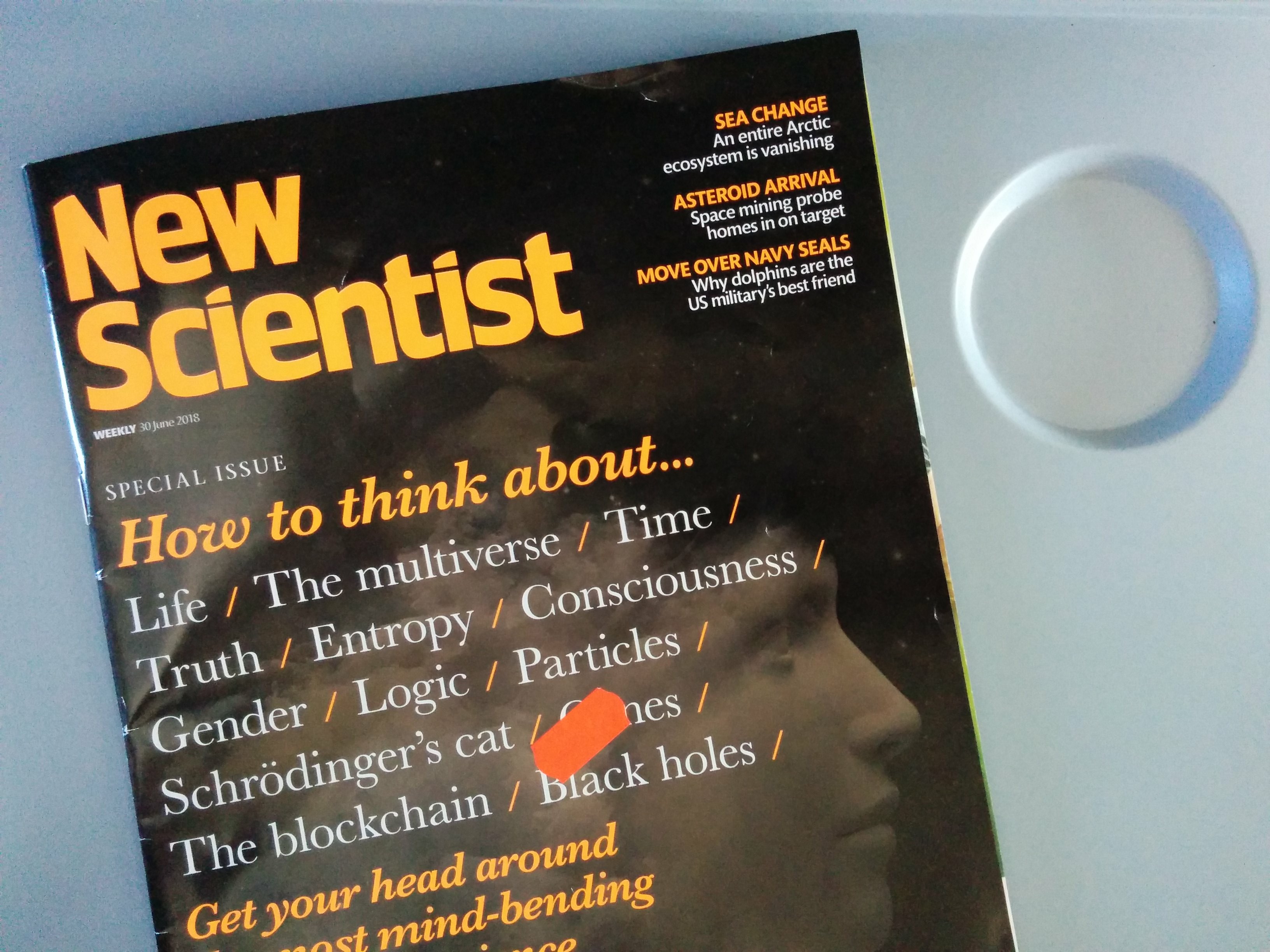 New Scientist mmagazine on the tray table of my seat