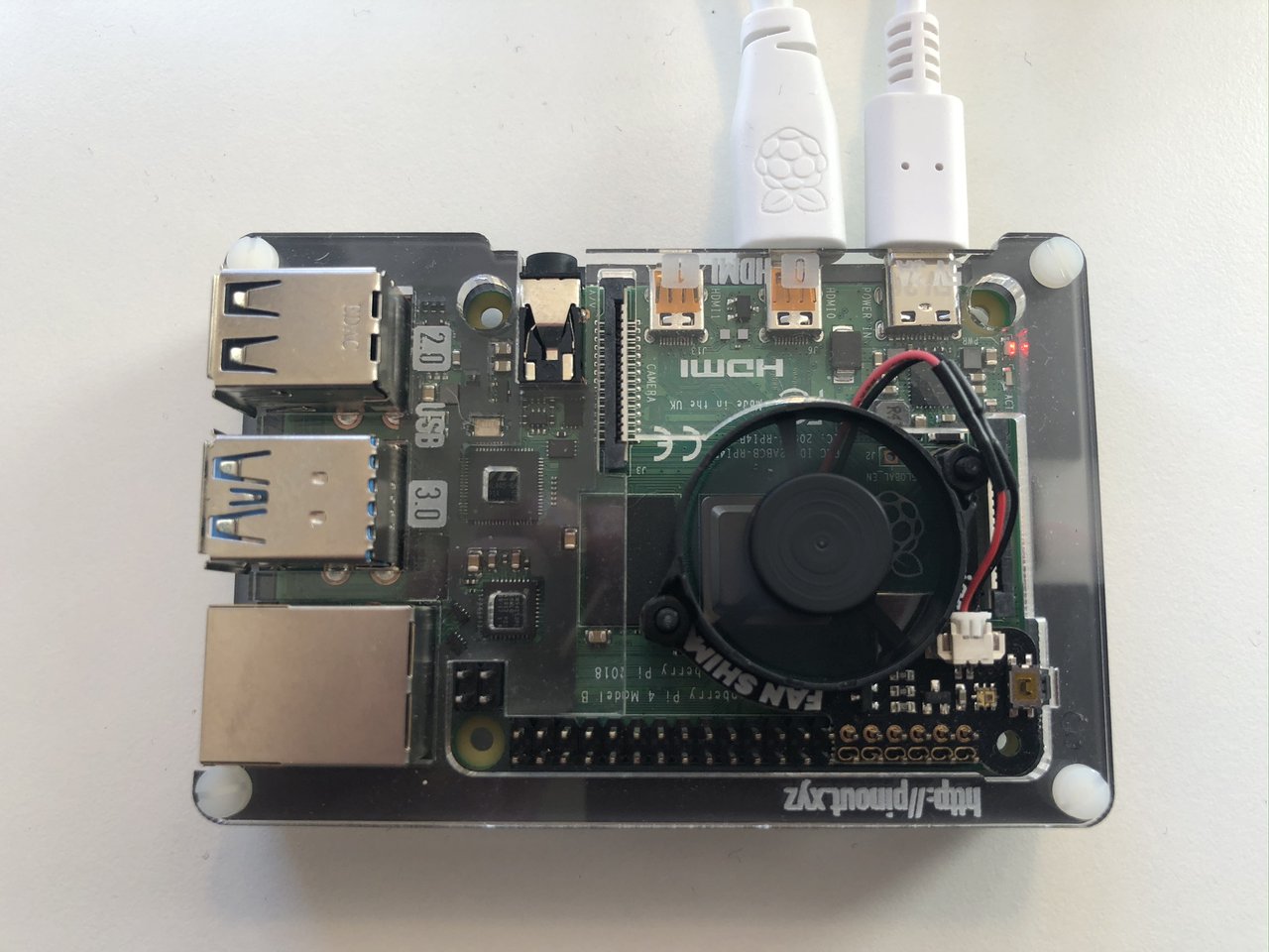 Photo of the Raspberry Pi 4B running the chat example in the first screenshot.