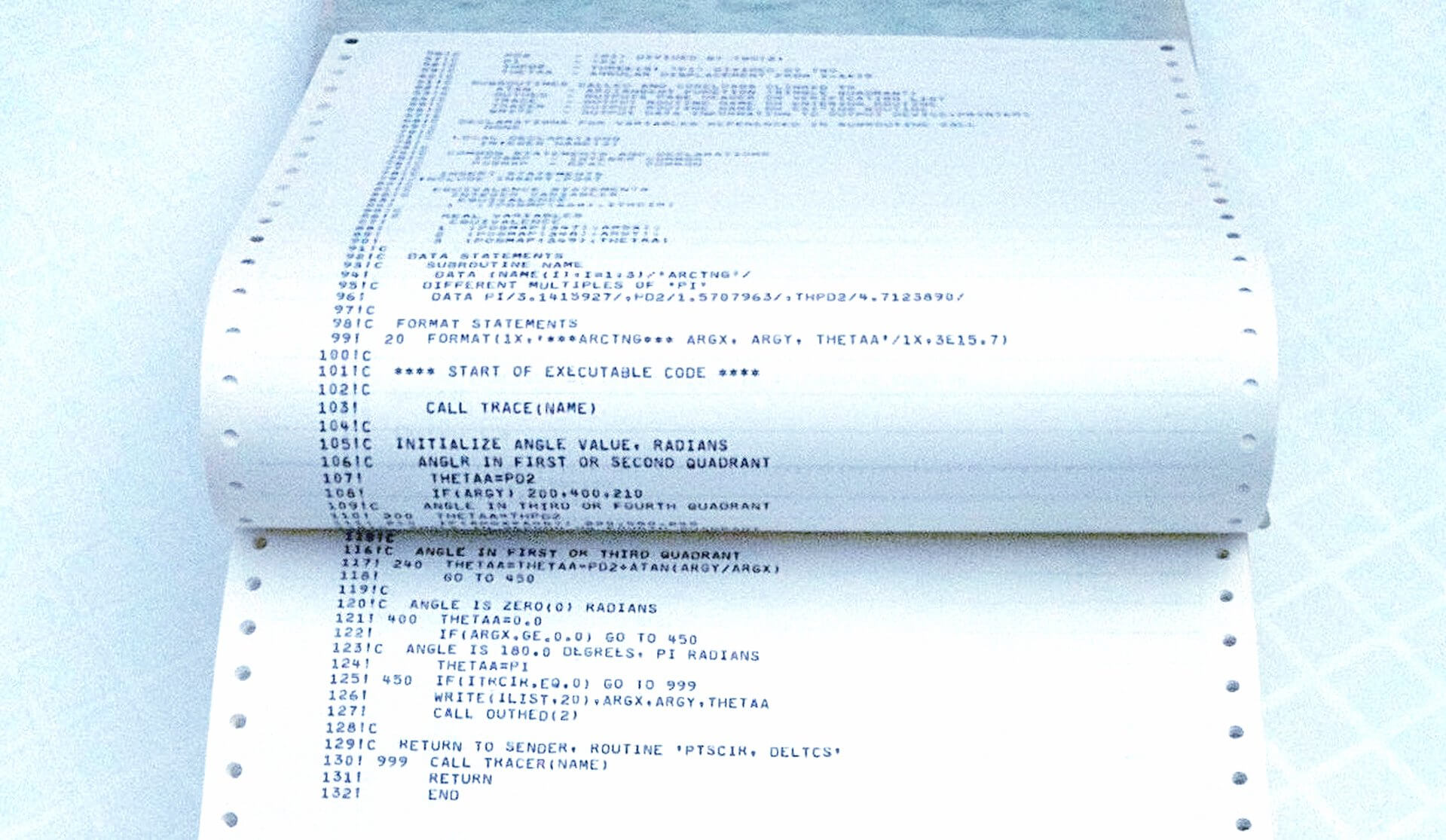 An old bound dot-matrix printout of computer code.