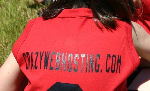 Woman wearing a sports jersey sponsored by crazywebhosting.com. Photo credit: grantlairdjr/Flickr.